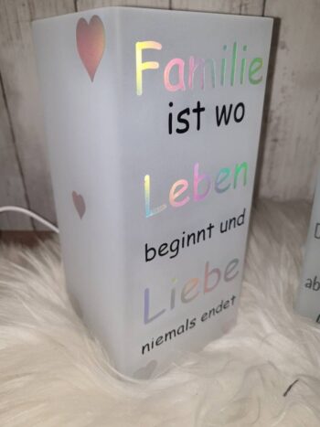 Glaslampe Familie ist wo Leben beginnt